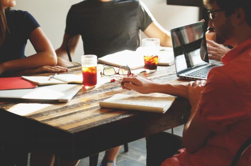 Laptop open on a desk with a team reviewing an email marketing and Klaviyo segmentation dashboard