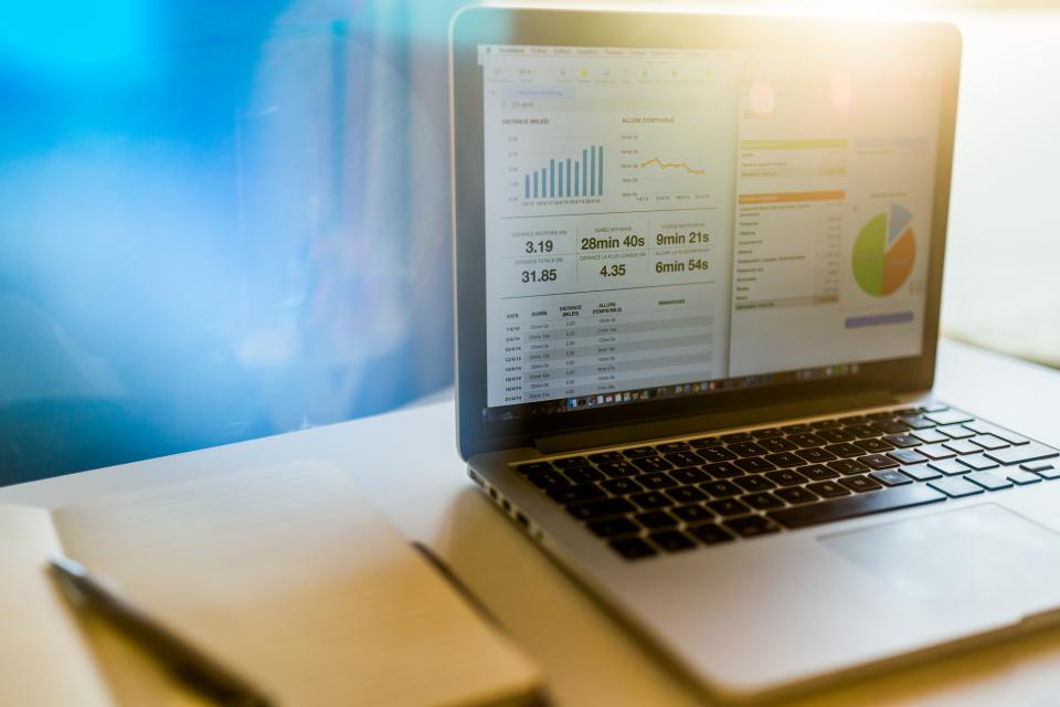 Laptop showing a spreadsheet used to audit Shopify app costs